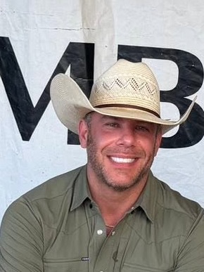 Brandon Tatarevich of Lonestar Parish, in a straw cowboy hat and olive shirt