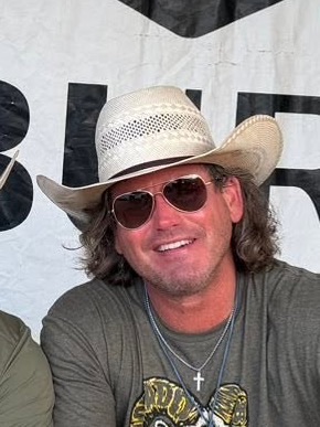 Chuck Yielding of Lonestar Parish, in a straw cowboy hat and sunglasses